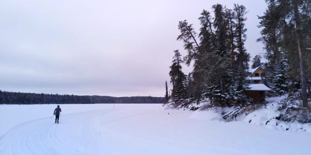 Image shows a person cross-country skiing, one of many fan-favourite Whiteshell winter activities.